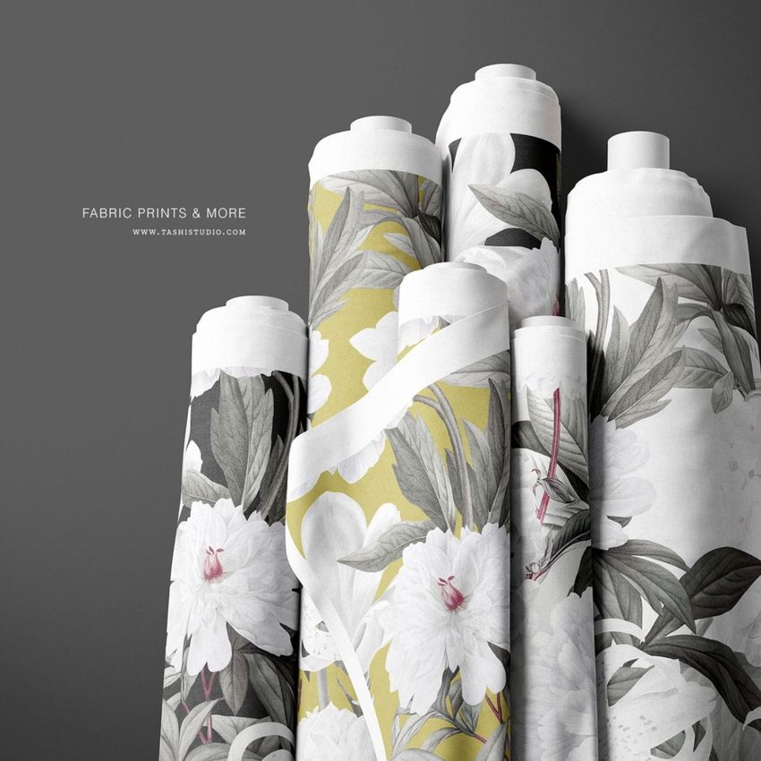 Fabric rolls mockup featuring six upright rolls with floral patterns in white, gray, and yellow on a neutral background.