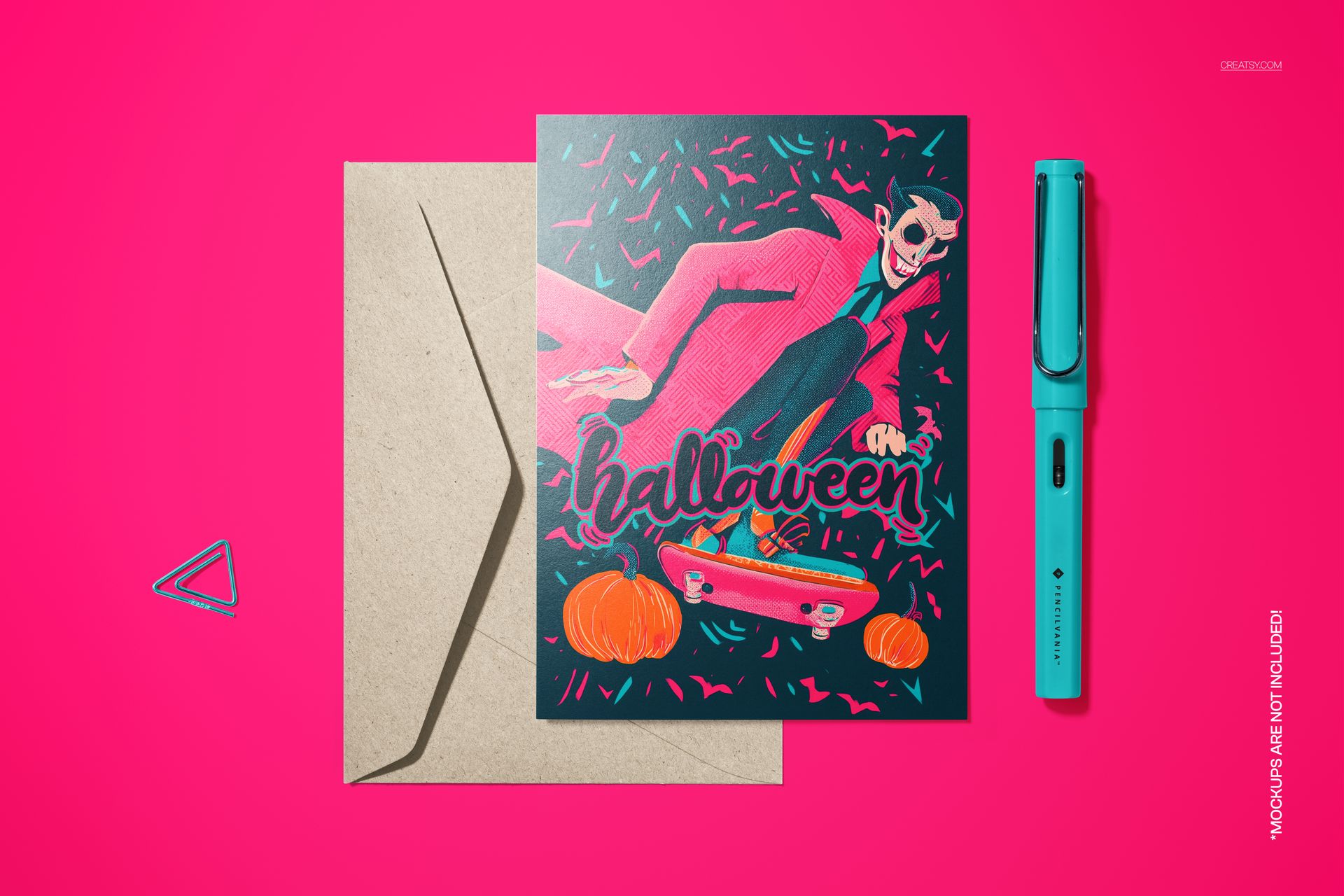 Vintage Halloween card mockup with illustrated vampire in red cloak, pumpkins, and skateboard, shown beside kraft envelope.