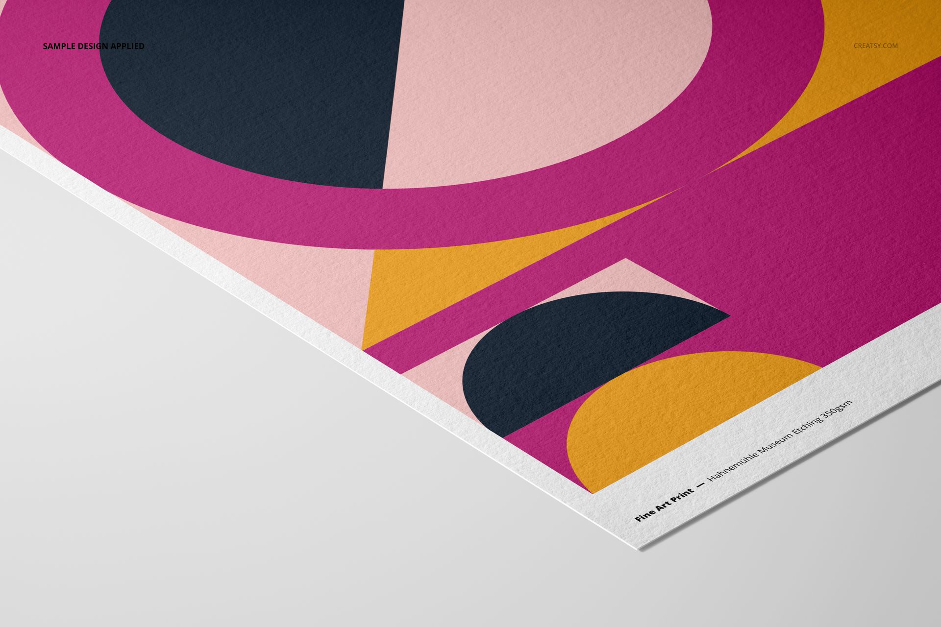 A3 fine art print mockup featuring bold geometric shapes in pink, black, and yellow tones on textured paper.