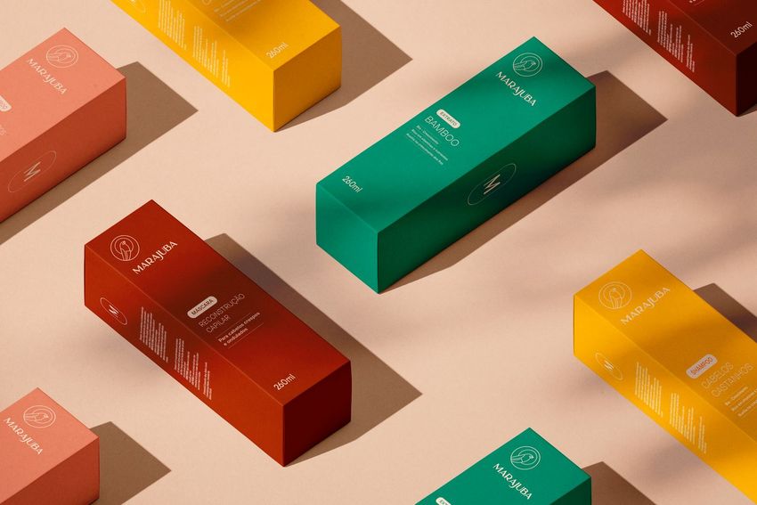 Tall box mockup featuring multiple rectangular packaging boxes in red, yellow, and green, arranged on a beige surface.