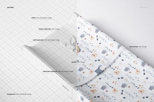 Changing pad mockup showing a rectangular pad with a floral pattern, safety belt, and grid overlay, top view.