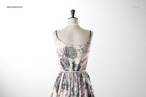 Mockup of a floral-patterned sleeveless dress in soft pink tones, shown on a mannequin against a plain background.