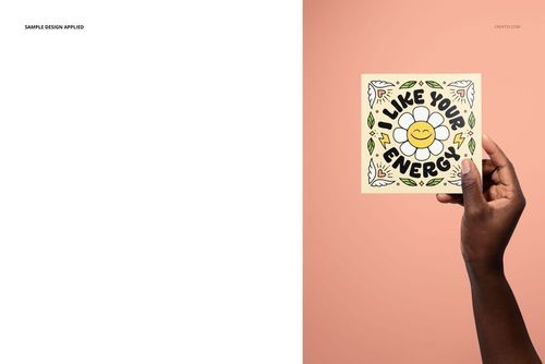 PSD mockup of a square folded greeting card with colorful floral illustration, displayed in a person's hand.