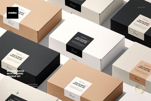PSD mockup of packaging boxes with stickers in black, white, and brown, displayed from a high perspective.