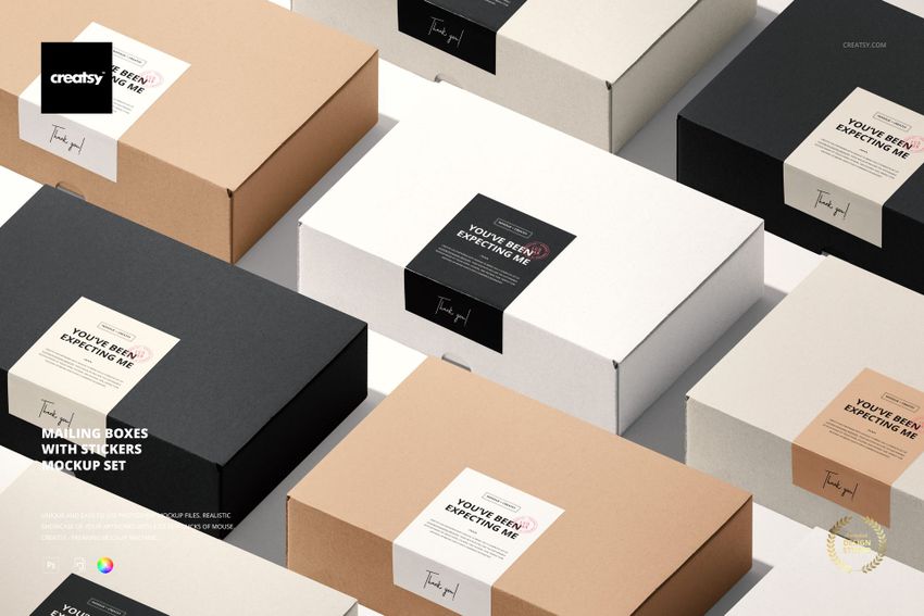 PSD mockup of packaging boxes with stickers in black, white, and brown, displayed from a high perspective.