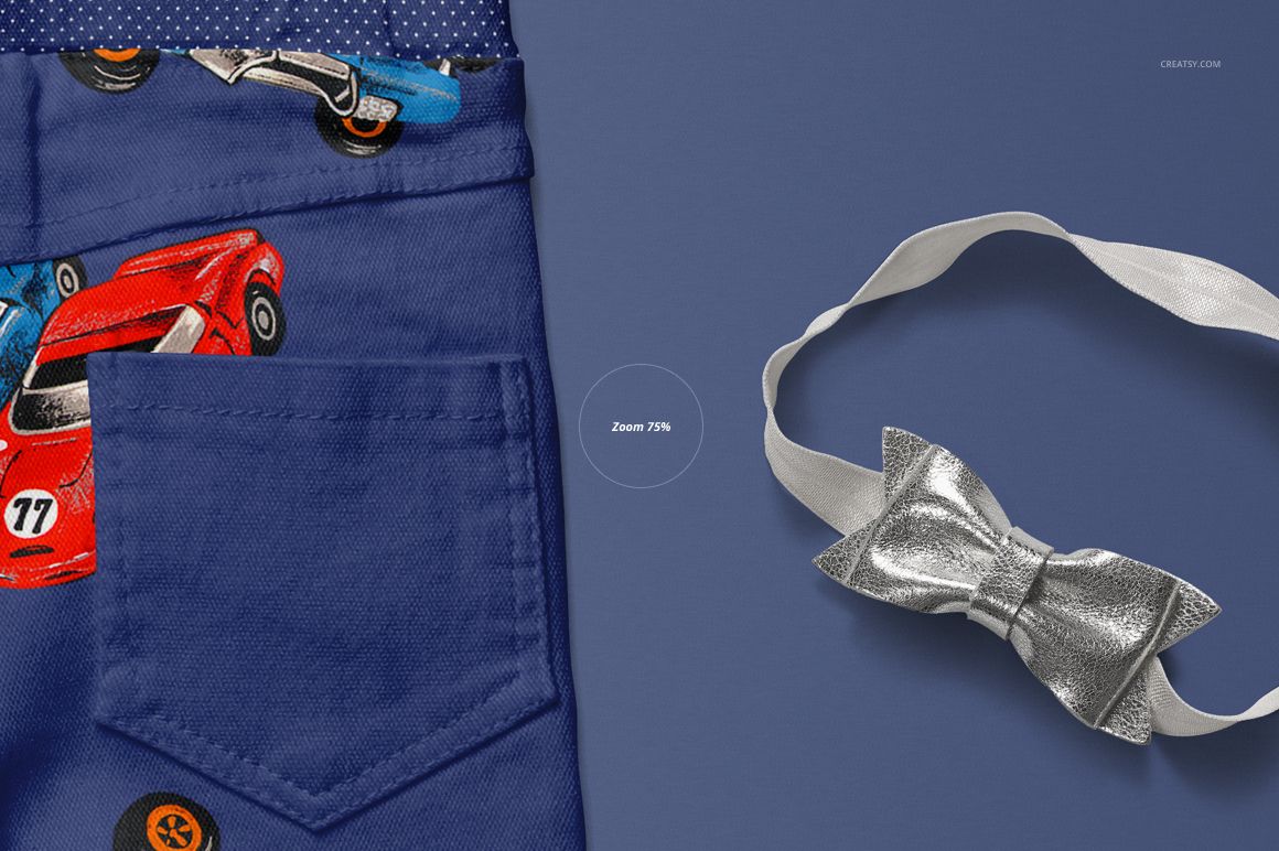 PSD mockup showing detailed blue children’s pants with car print and a metallic bow tie on a solid blue background.