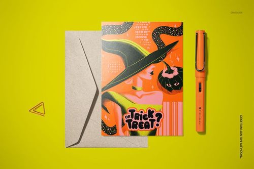 Halloween card mockup featuring a stylized witch, pumpkin, and bold text, shown beside a kraft envelope and orange pen.
