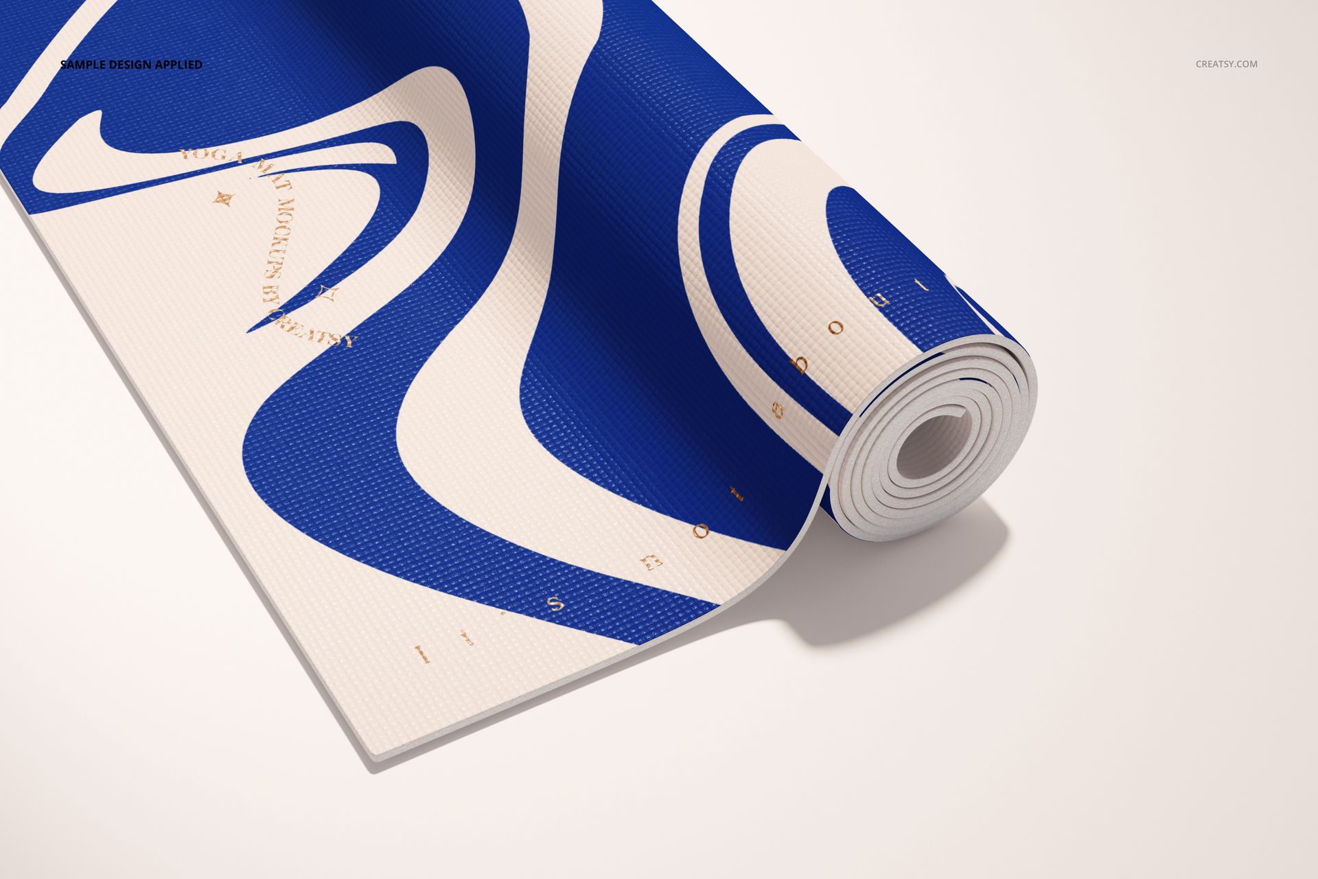 Yoga mat mockup featuring a rolled mat with bold blue and white curved design, displayed on a neutral background.