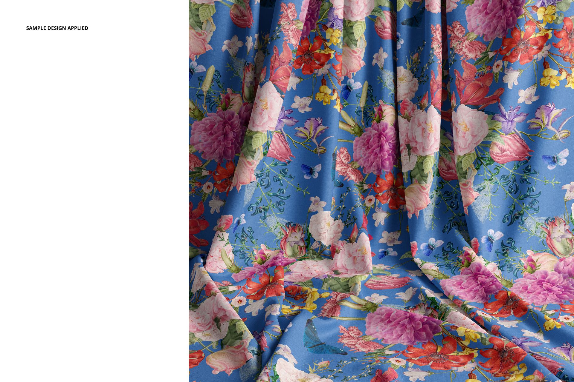 Front view of a draped fabric mockup with vibrant flowers and greenery on a blue base, displaying natural creases.