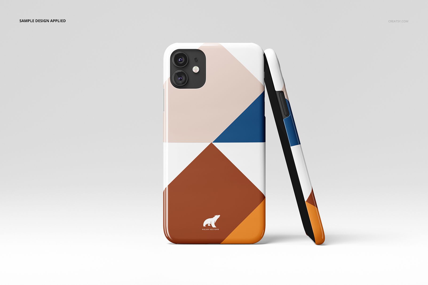 Mockup of iPhone 11 glossy snap cases displaying angular color blocks in blue, brown, beige, and white on a plain surface.