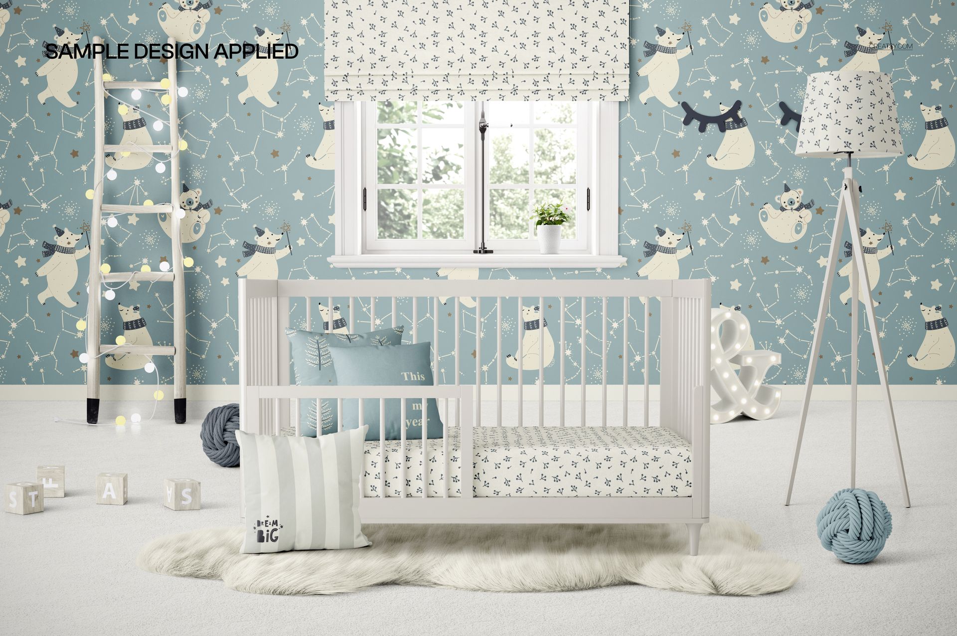 PSD mockup showing a white crib with bedding in a stylish nursery, surrounded by blue wallpaper and cozy accents.