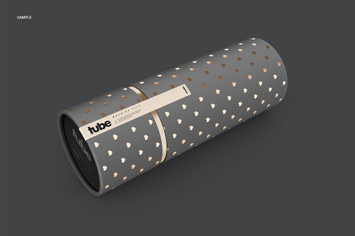 Paper tube mockup featuring a gray cylindrical container decorated with small metallic hearts, viewed from the side.