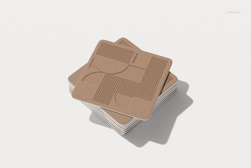 Square drink coasters mockup featuring a layered pile with abstract line and shape design, viewed from a slight top angle.