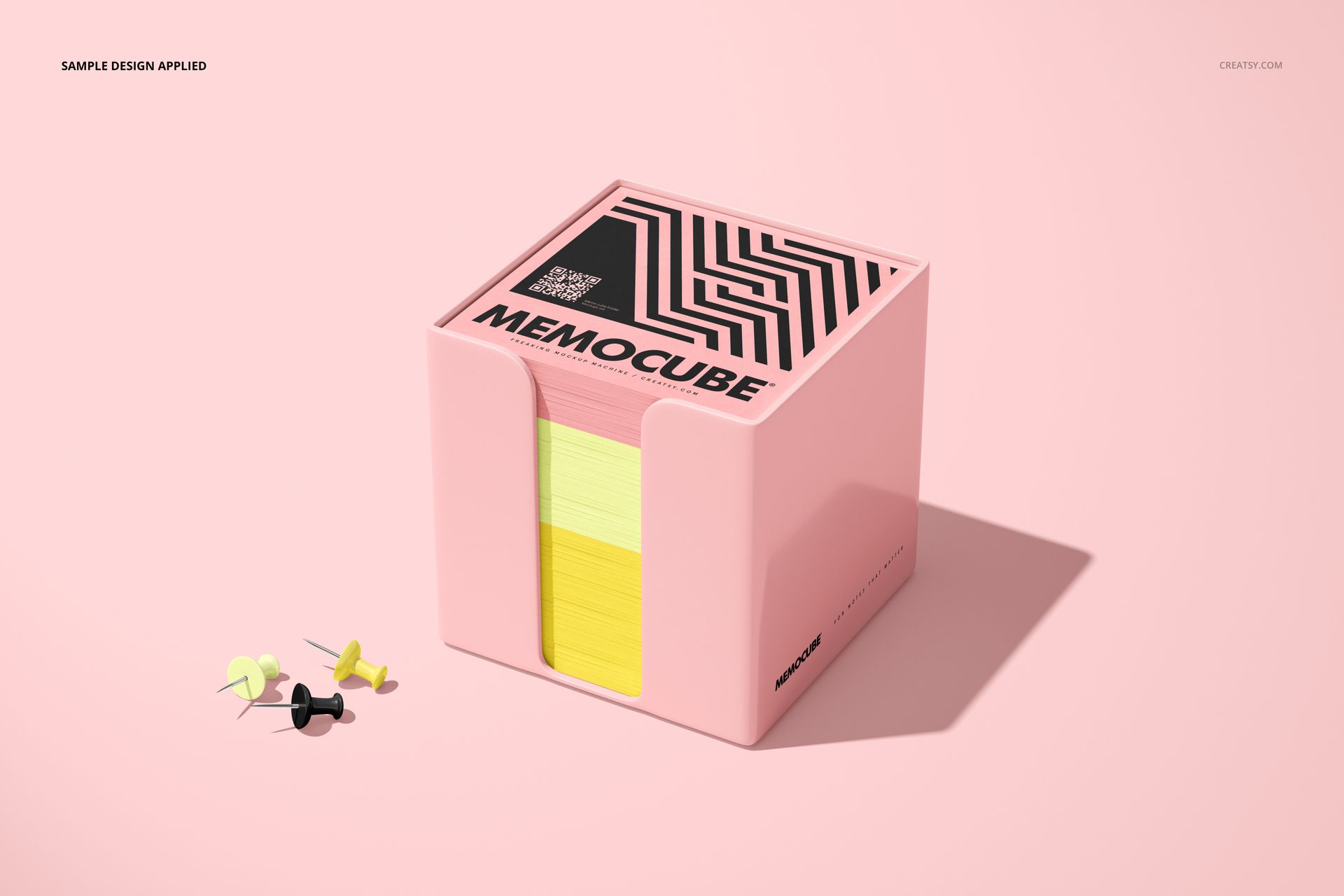 PSD mockup of memo block cube in pink acrylic holder, showing colorful paper sheets and decorative label on lid.