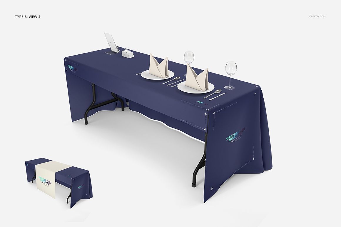 PSD mockup showing a table dressed in a blue tablecloth and runner, with folded napkins, plates, and wine glasses.