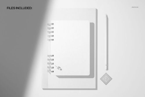 Spiral planner and notebook mockup shown from a top view on a light background with a pencil and metallic paperclip.