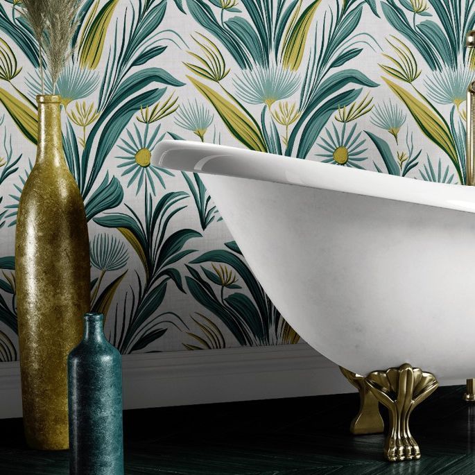 Victorian style bathroom mockup featuring a white clawfoot bathtub against a floral wallpaper with green and yellow leaves.