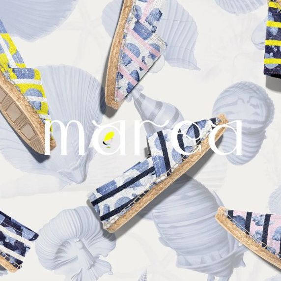 Canvas espadrilles mockup featuring several pairs arranged on a light background with large shell illustrations and a text overlay.