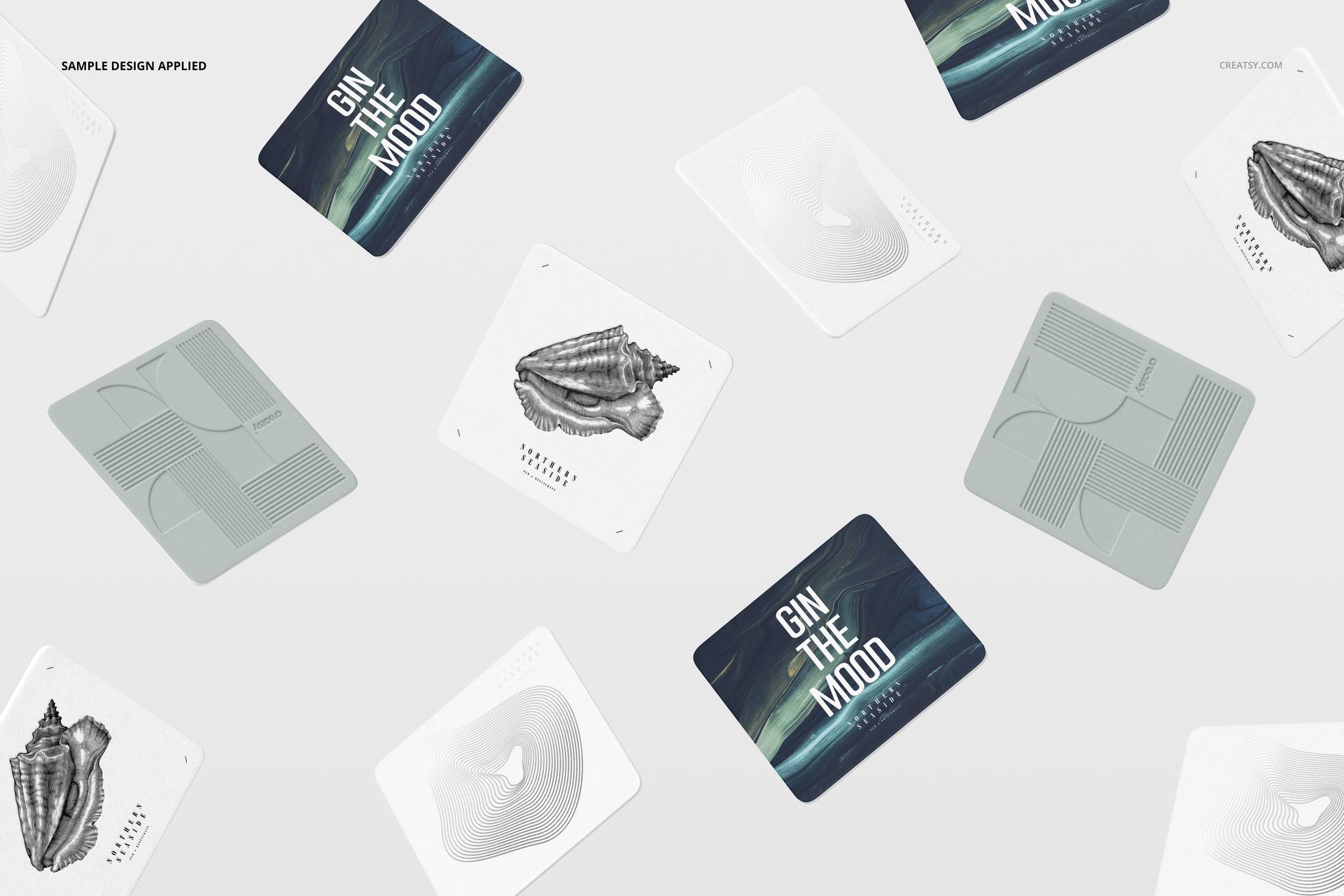 Multiple square coasters mockup featuring assorted artwork, text, and graphics, arranged on a plain white background.