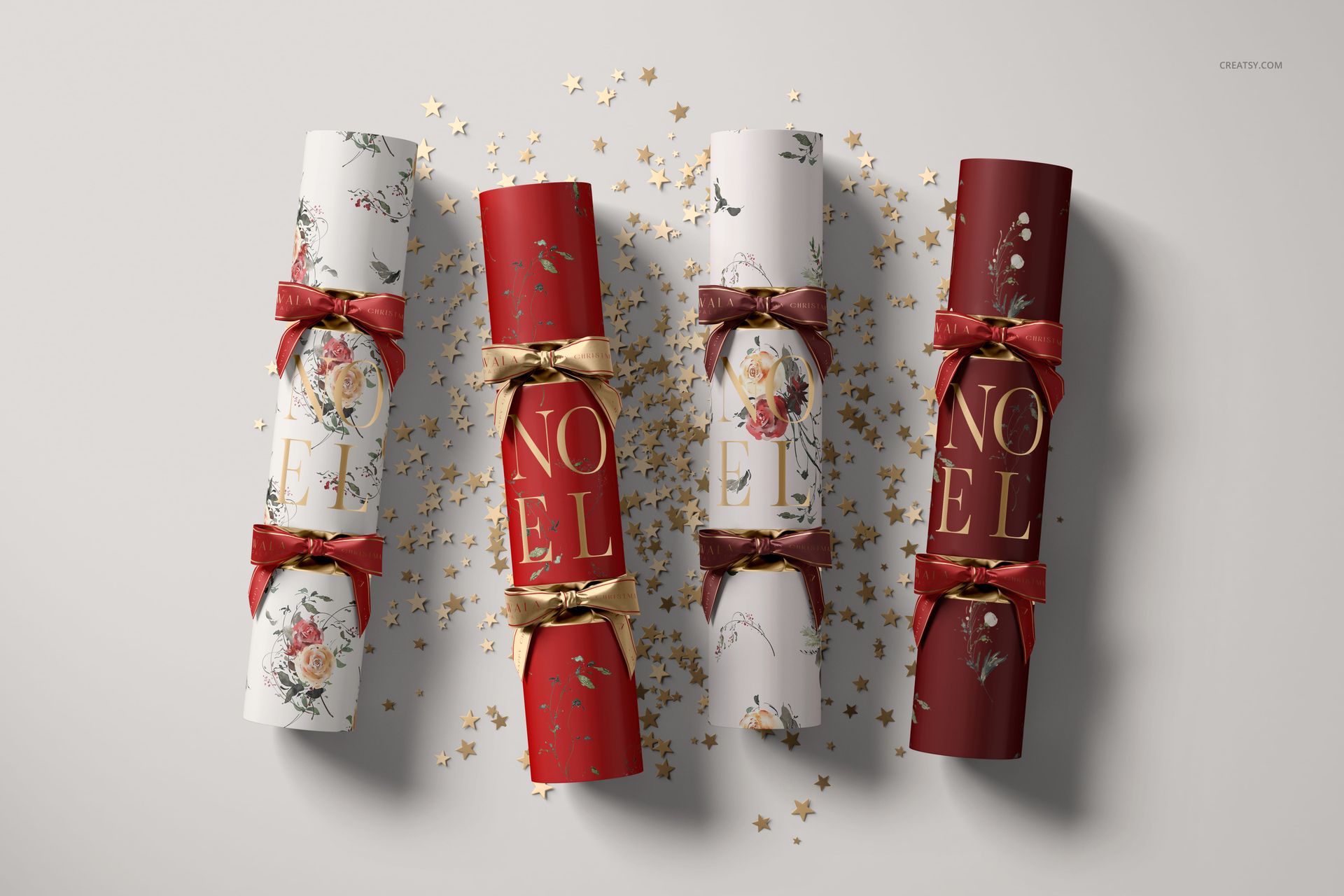 Christmas cracker PSD mockup featuring four crackers with floral motifs and gold accents, displayed with confetti on a light background.