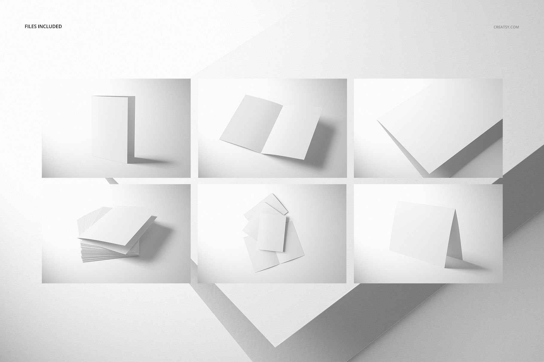Folded A4 cards mockup set featuring six white blank cards in various positions on a light background.