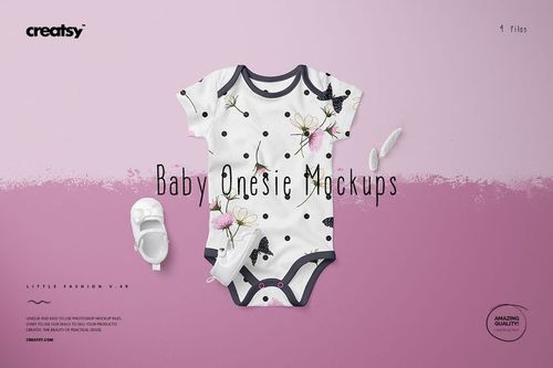 Front view of a baby onesie mockup with black trim, featuring a floral and butterfly pattern on a white background, set on a pink surface.