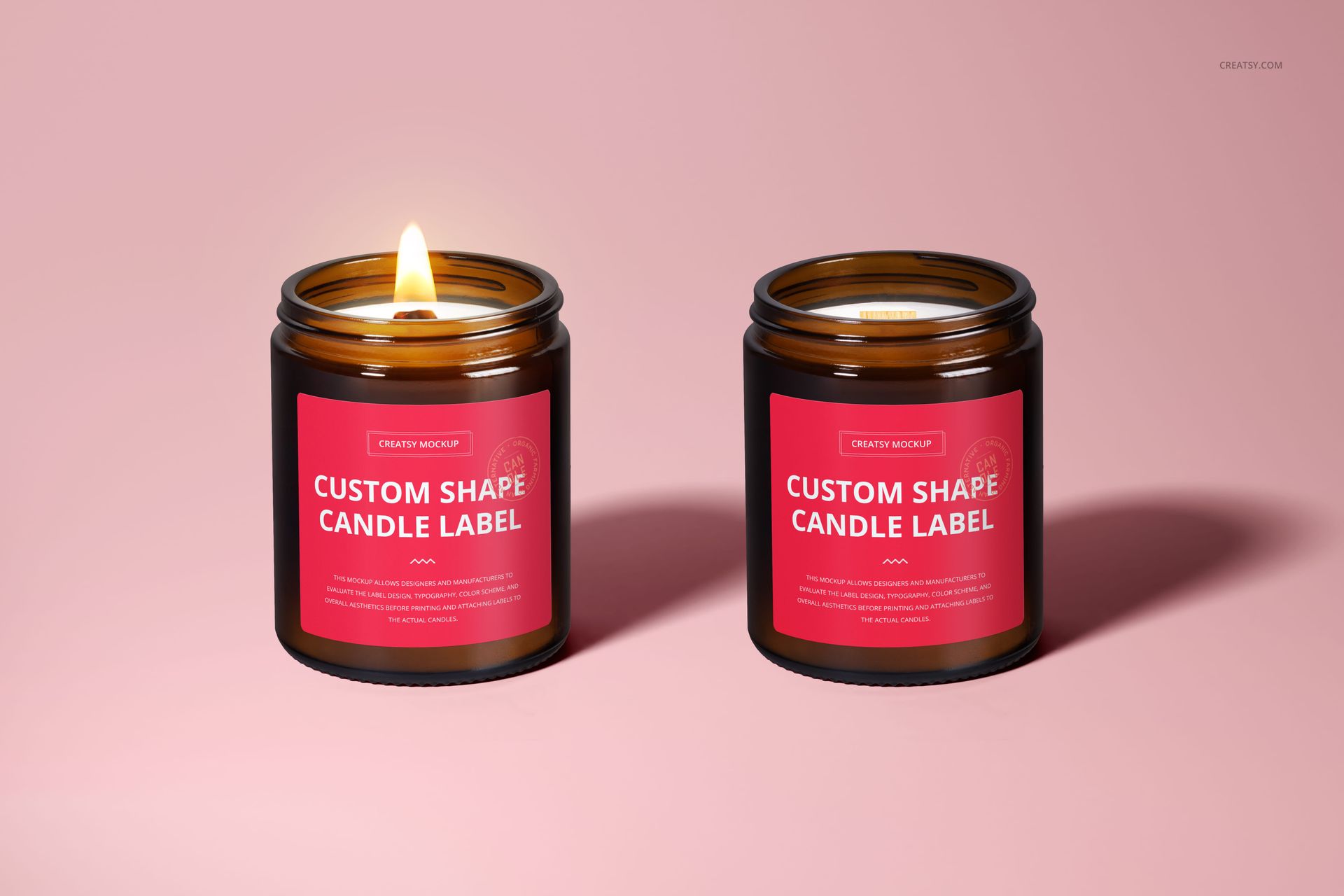 Amber jar candle mockup set featuring two candles with wooden wicks and red labels, displayed on a pink background.