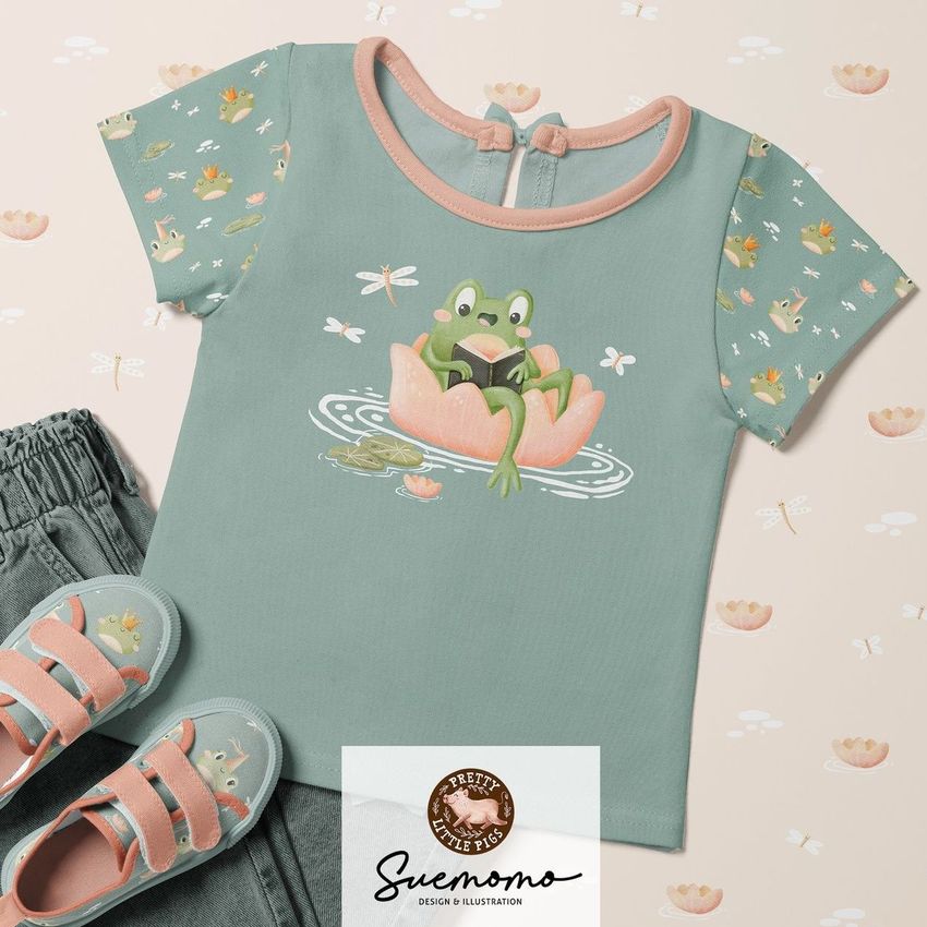 Kids t-shirt mockup with a frog illustration on a pastel green shirt, paired with jeans and matching shoes on a light background.