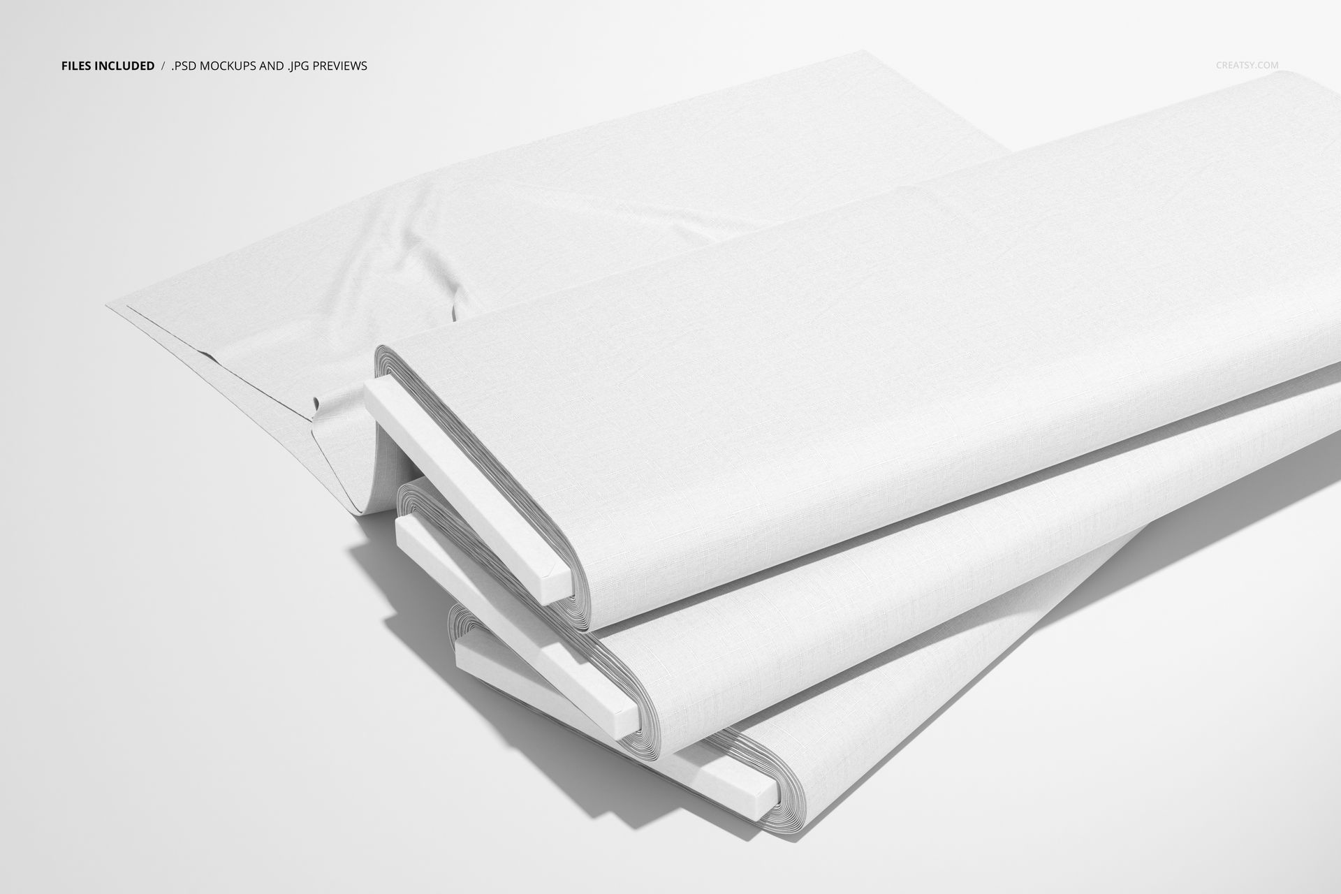 Fabric Bolts Mockup set featuring three plain white textile bolts arranged diagonally on a neutral background.