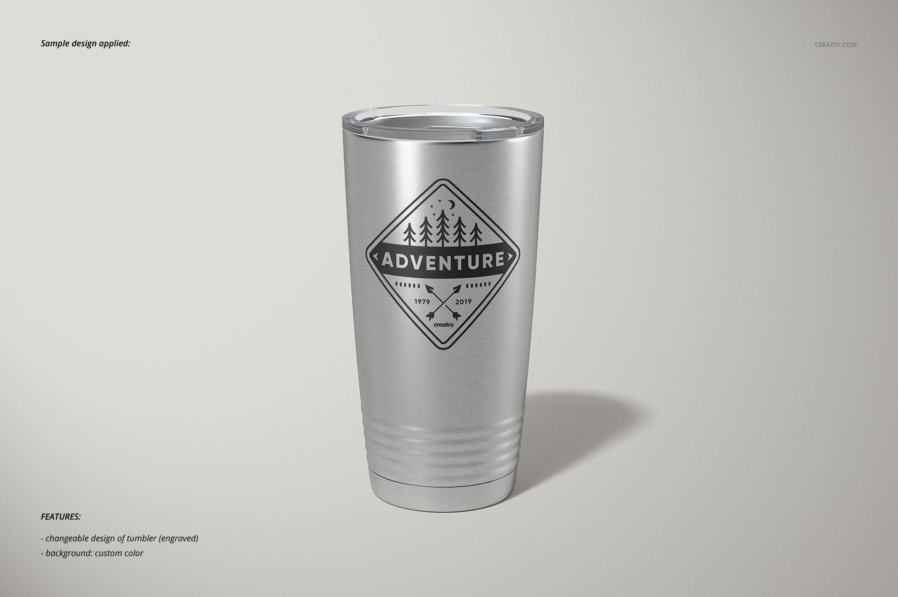 Stainless steel tumbler with a clear lid shown from the front on a light background, featuring a geometric logo design.