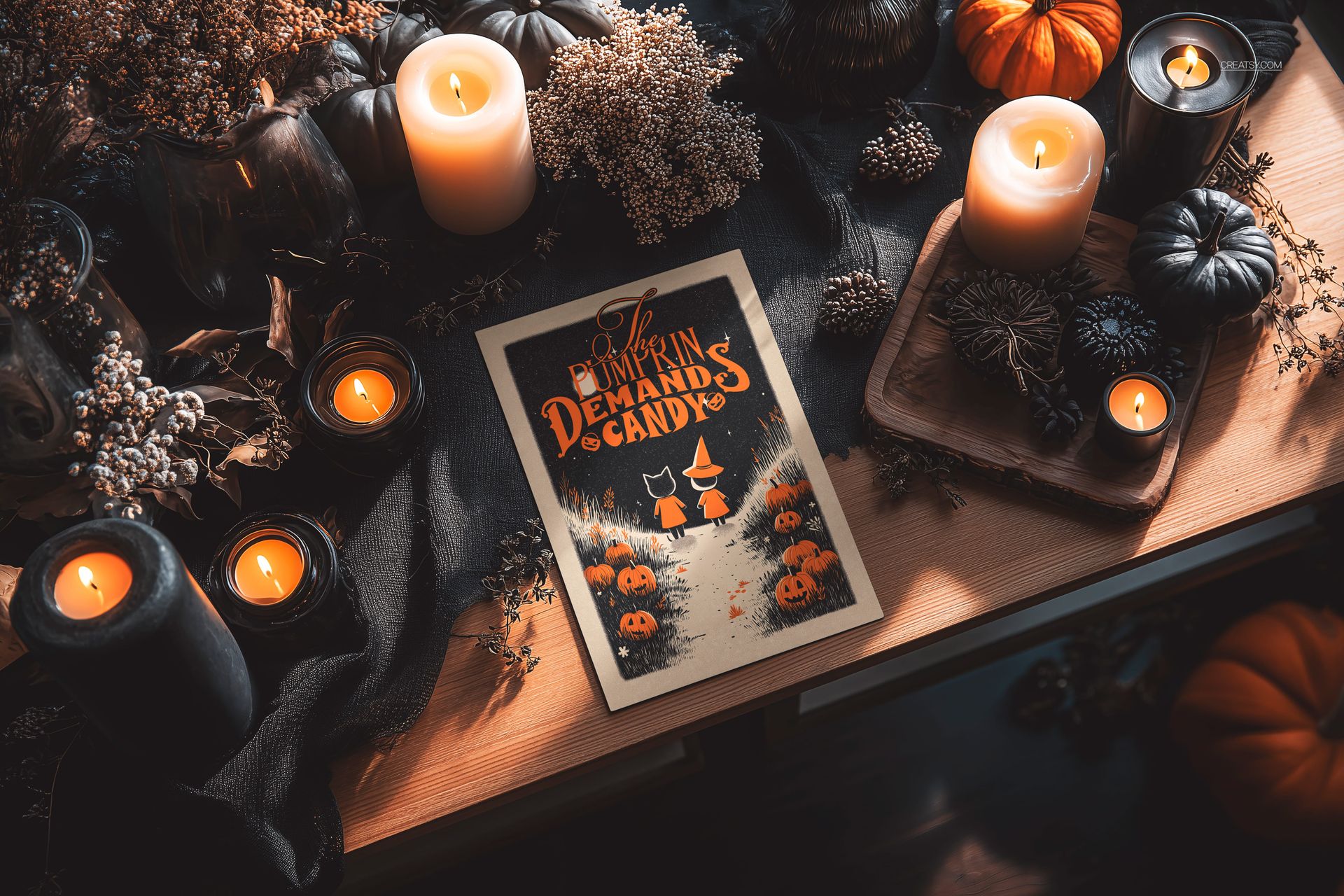 Halloween greeting card mockup displayed on a wooden table surrounded by lit candles, pumpkins, and autumn decor.