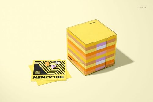 Stationery mockup featuring a square memo block cube in an acrylic holder, with colorful striped sides and loose memo sheets.