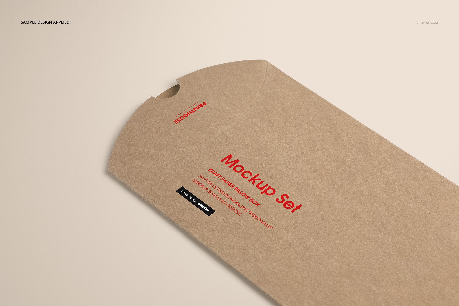 Rectangular kraft paper pillow box mockup with a smooth brown surface and red text, viewed from above on a neutral surface.