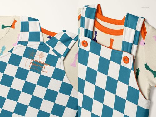 Front view of a baby bodysuit and overalls mockup with blue and white checkerboard pattern and orange buttons.