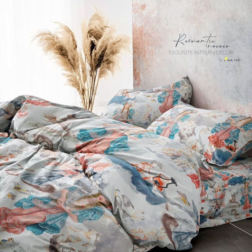 Wrinkled duvet cover and pillowcases mockup featuring a colorful rococo-inspired pattern, styled on a bed with pampas grass decor.