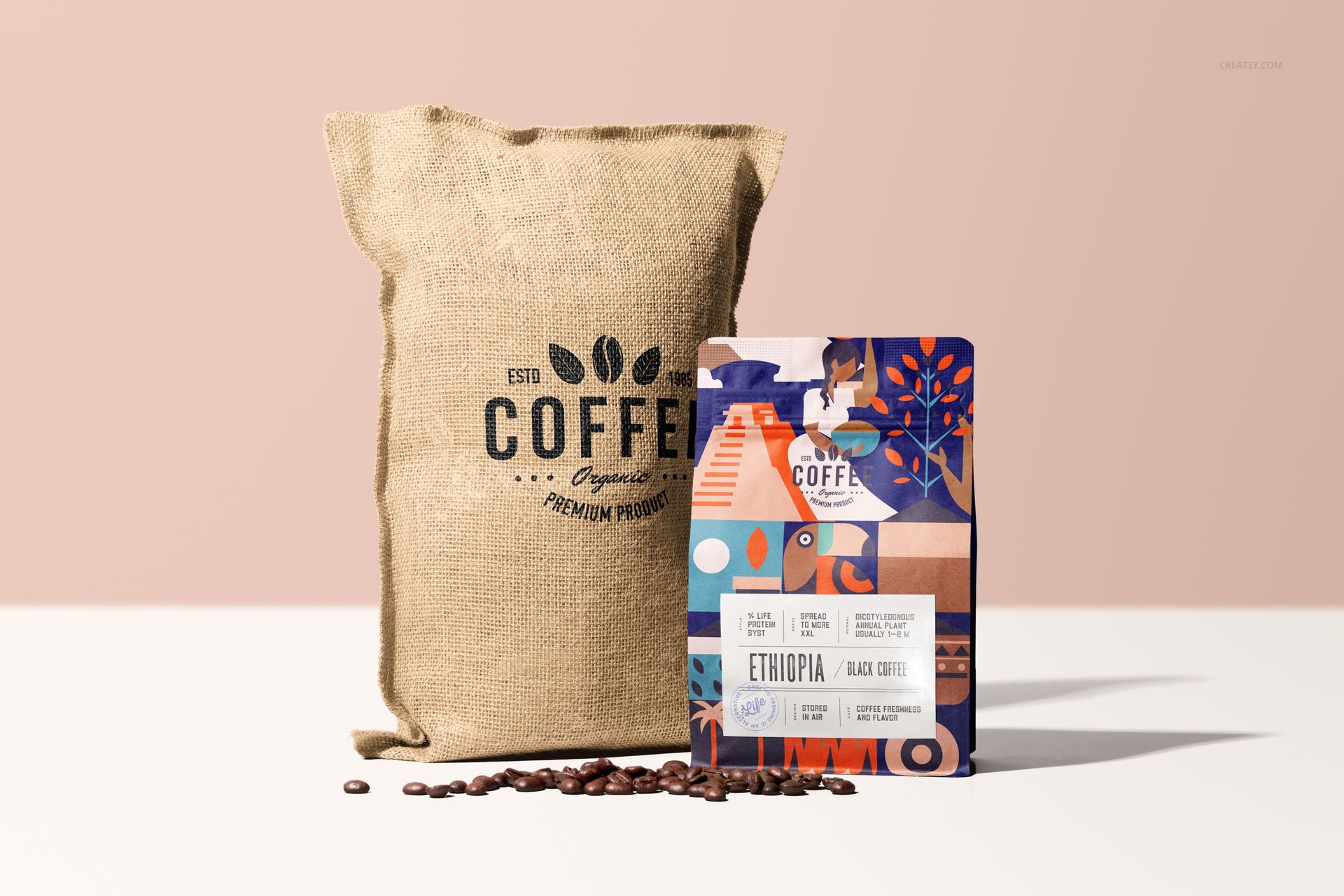 PSD mockup showing a textured sack labeled coffee beside a vibrant patterned bag on a light surface with coffee beans.