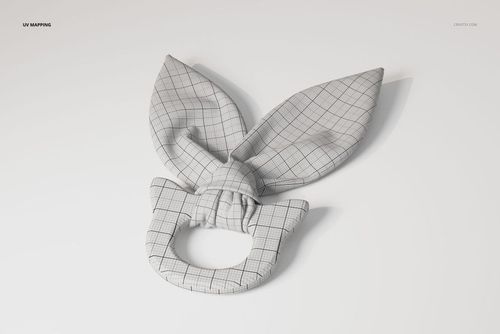 Wooden teether toy with a ring base and two fabric bunny ear shapes, shown in a front view with grid pattern.