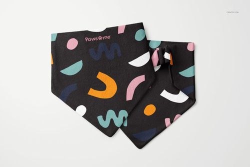 PSD mockup of a pet bandana and scrunchie with playful shapes in orange, blue, pink, and green on dark fabric.