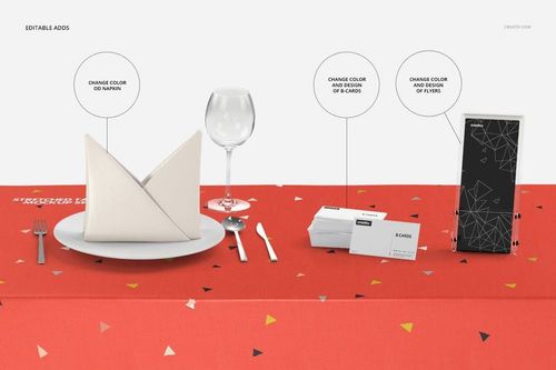 Front view of a red stretch tablecloth with geometric patterns, set with napkin, plate, glass, business cards, and flyer mockups.