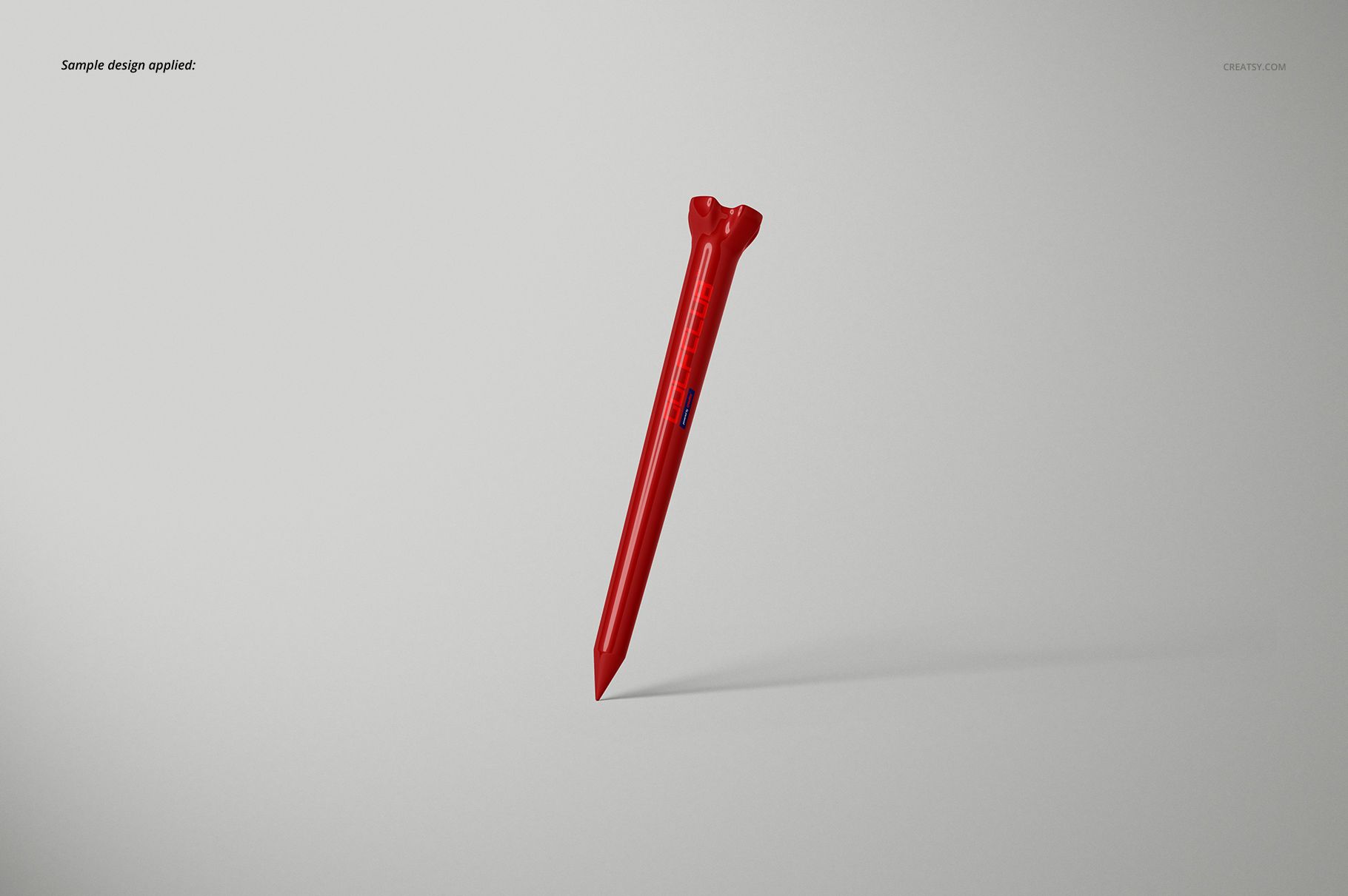 Single red golf tee mockup displayed upright against a plain light gray background with subtle shadows.