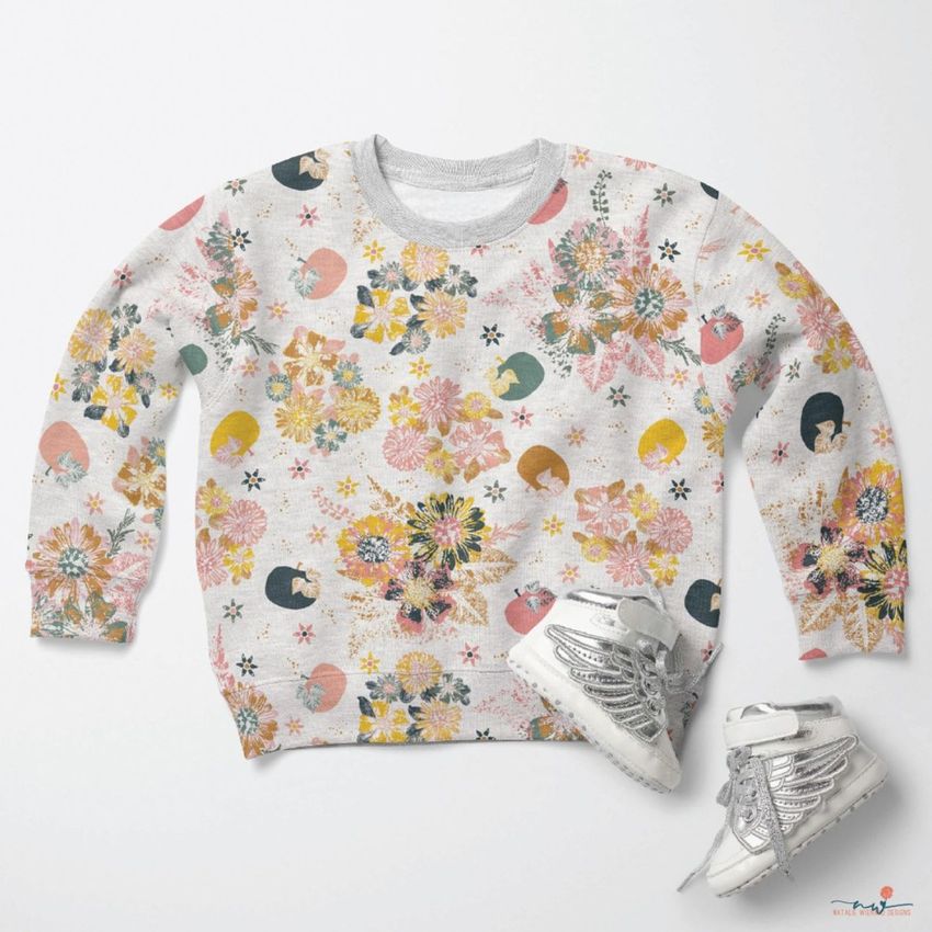 Baby sweatshirt mockup featuring a light gray sweatshirt with a colorful floral pattern, paired with silver baby shoes on a white background.