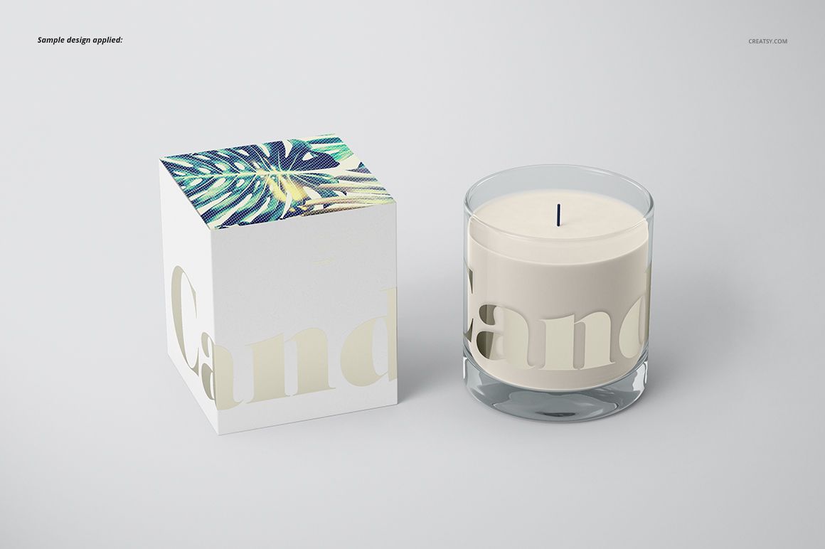Classic candle PSD mockup showing a round glass candle and a decorative box with botanical artwork on the lid.
