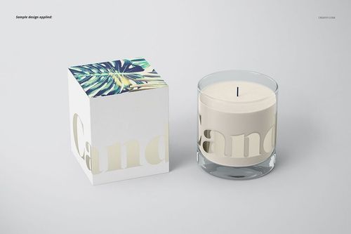 Classic candle PSD mockup showing a round glass candle and a decorative box with botanical artwork on the lid.