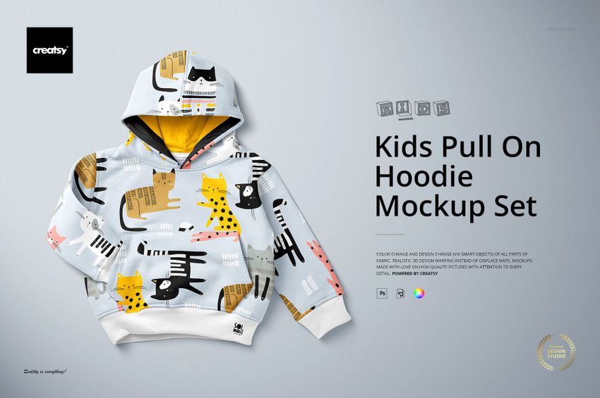 PSD mockup of a children's hoodie with cartoon cat designs, presented flat with visible hood and cuffs against a neutral background.