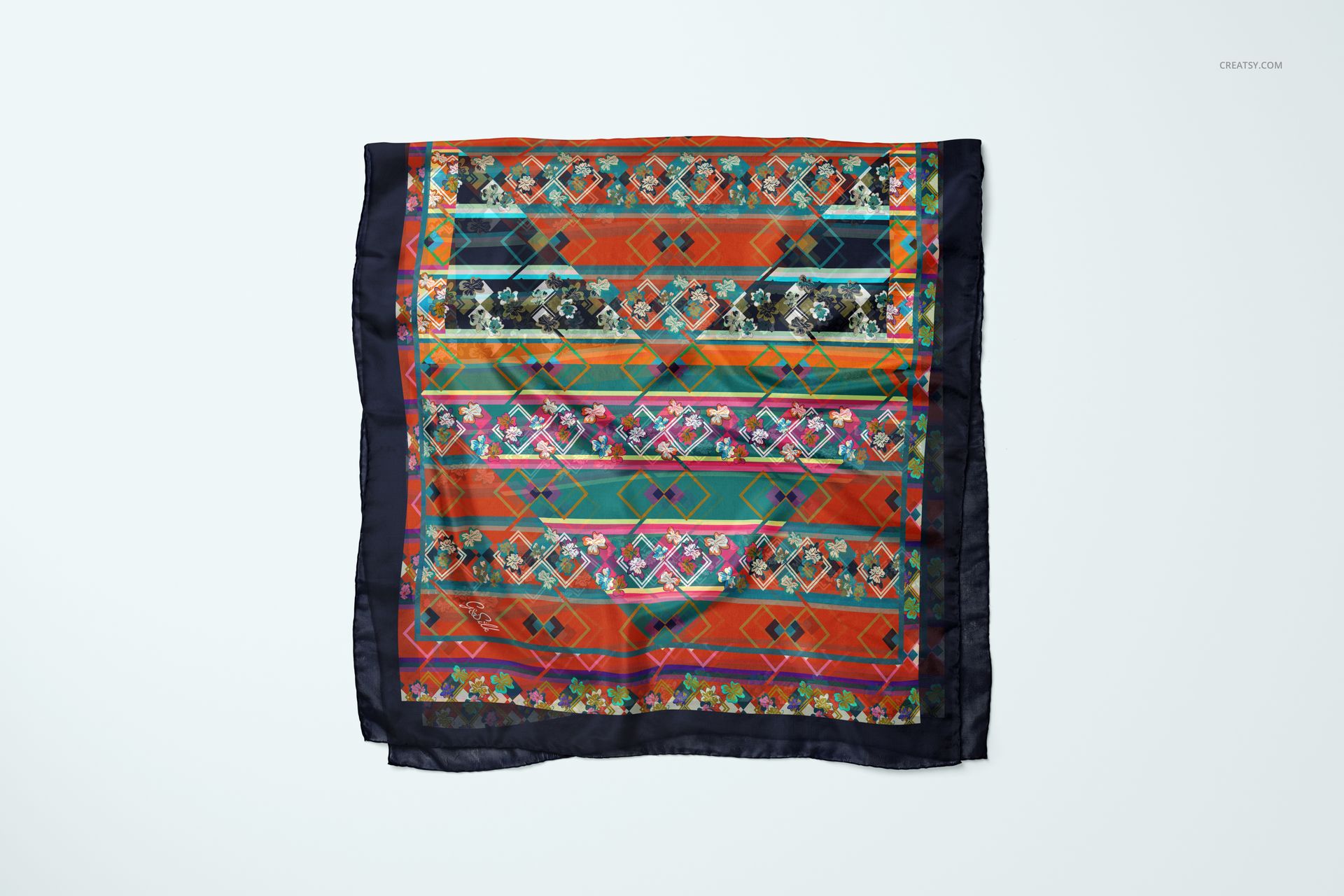Silk scarf mockup featuring vibrant stripes and floral accents, shown from a top view against a plain surface.