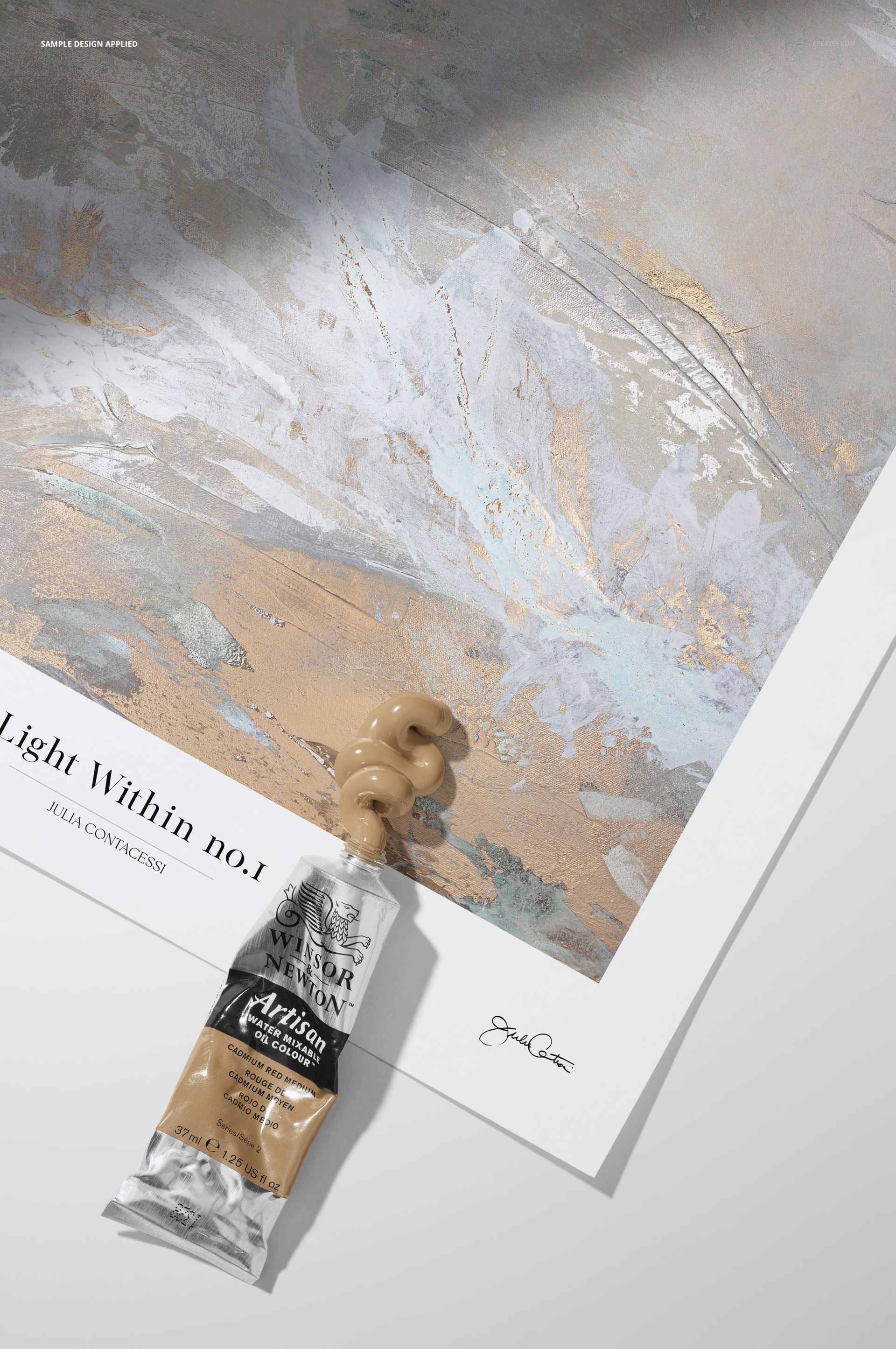 Artistic paper mockup showing abstract painting details with a squeezed paint tube and beige paint on the surface.