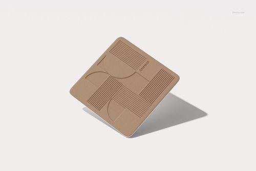 Single square drinkware coaster mockup featuring abstract embossed lines and shapes, shown in a floating perspective.
