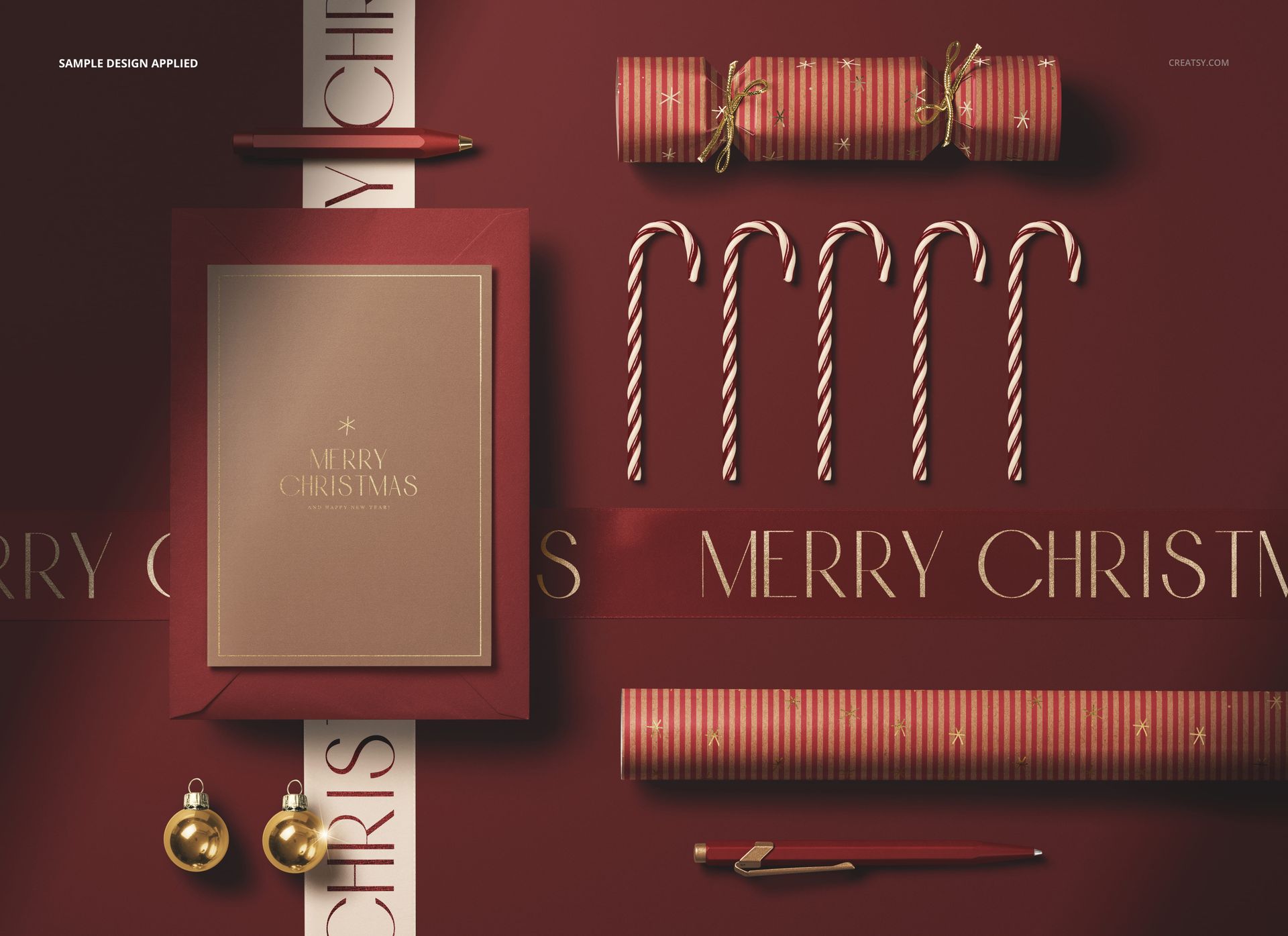 Greeting card and Christmas cracker mockup on a red background with candy canes, ornaments, and festive props.
