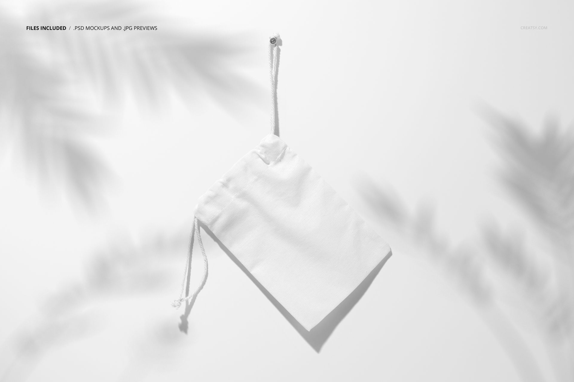 Minimalist mockup of a blank drawstring bag hanging by its cord, shown from the front with leafy shadows in the scene.