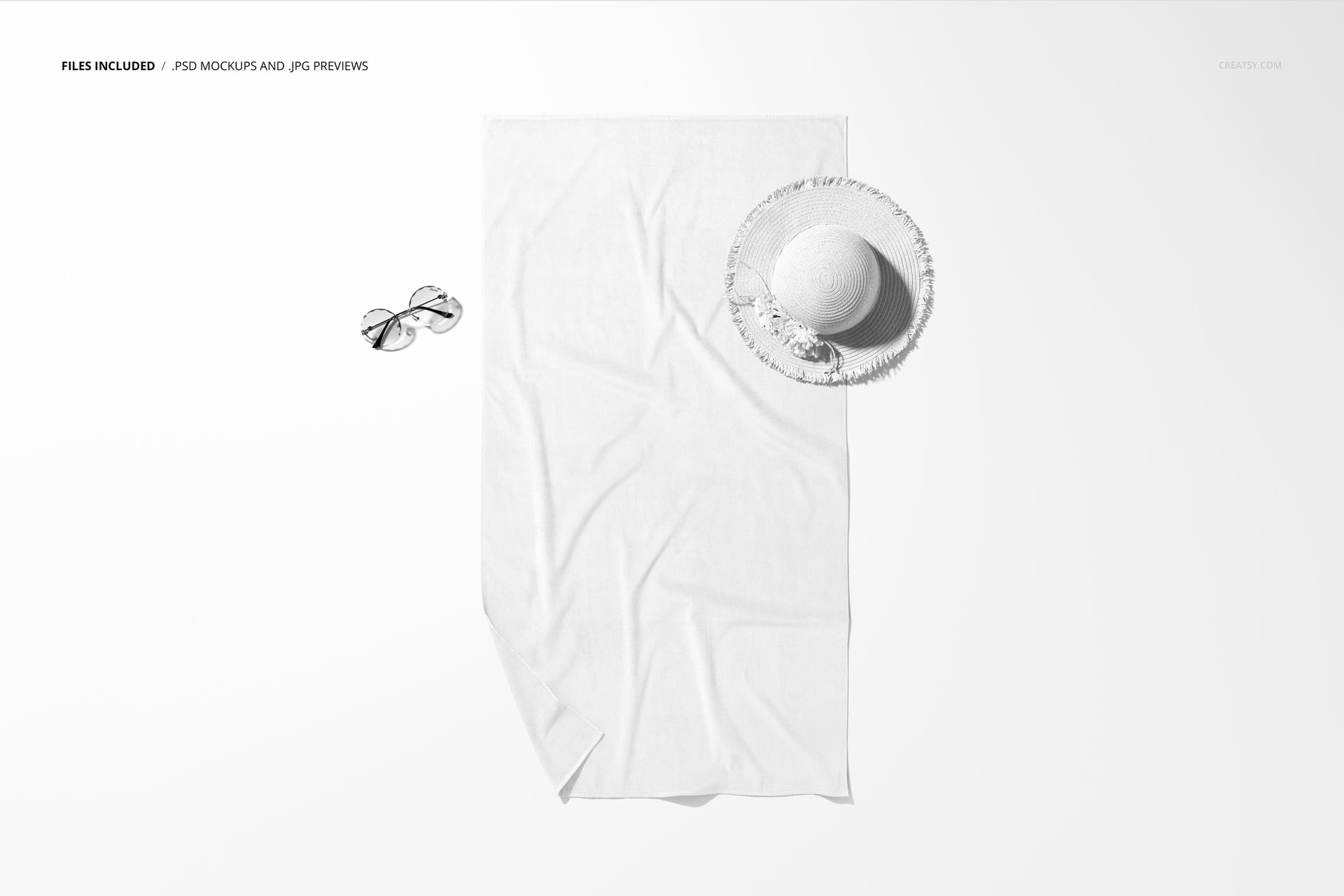 White beach towel mockup displayed from a top view, with a sun hat and sunglasses placed on a plain background.